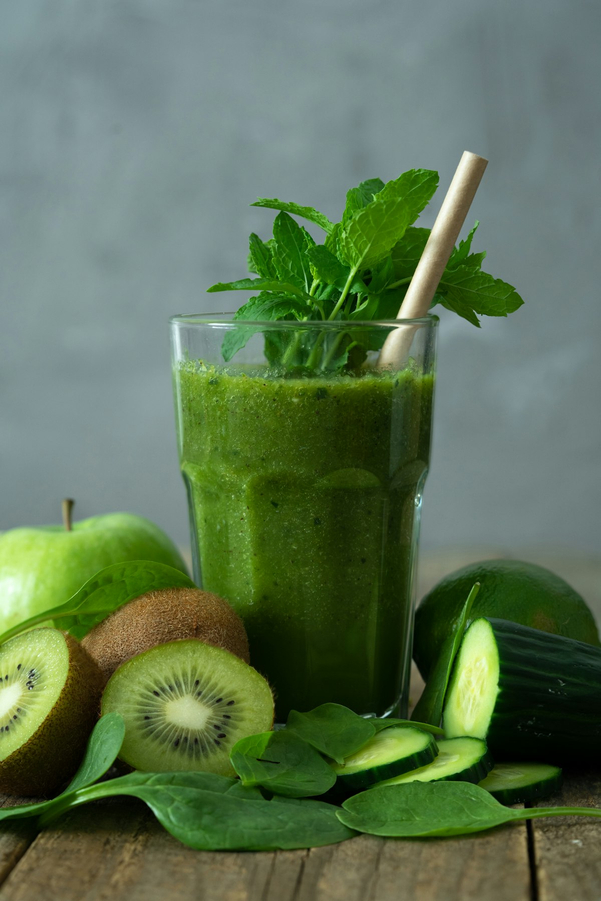 Man drinking a green smoothie